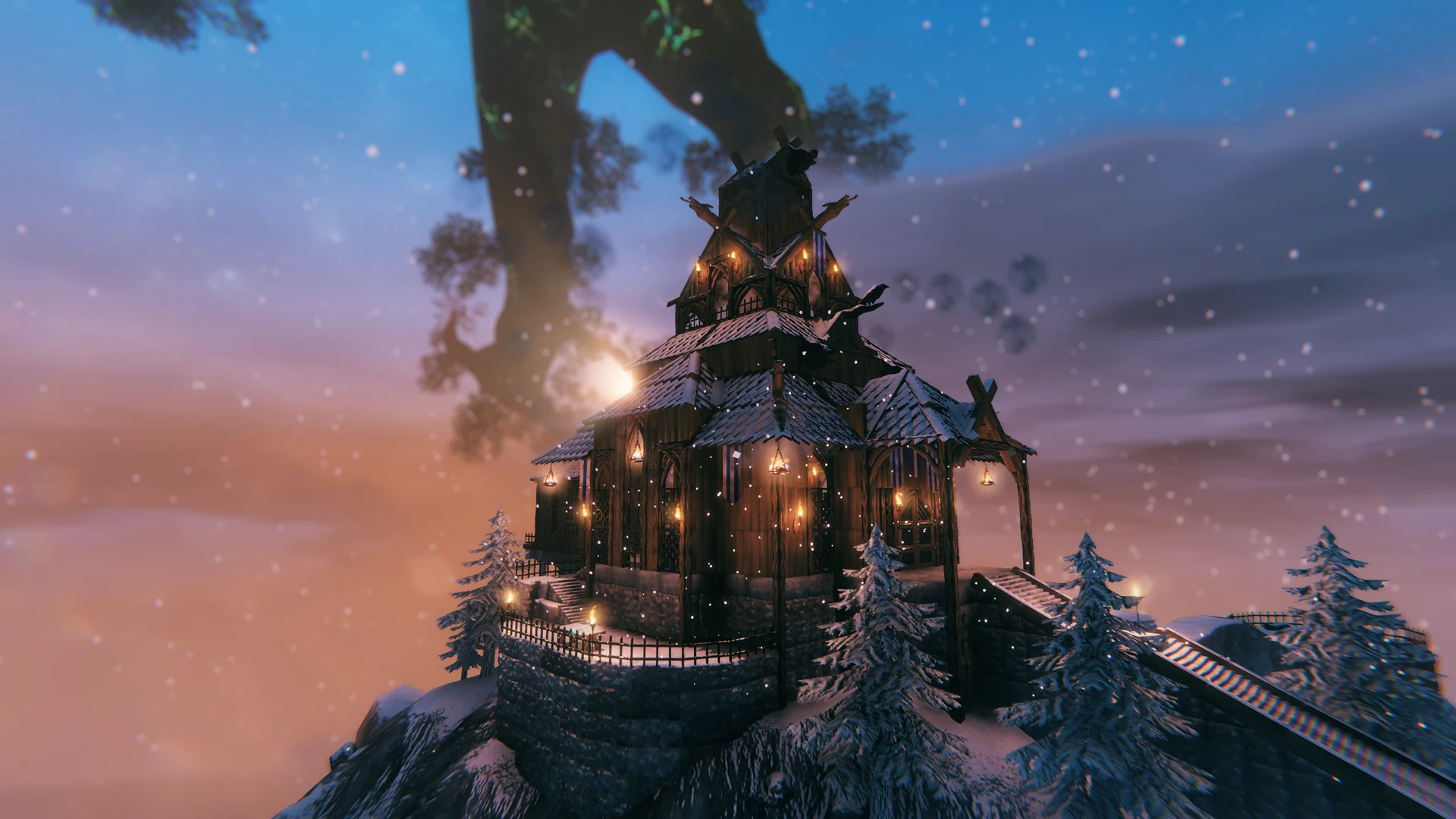 A towering timber castle illuminated at sunset in a snowy mountain landscape